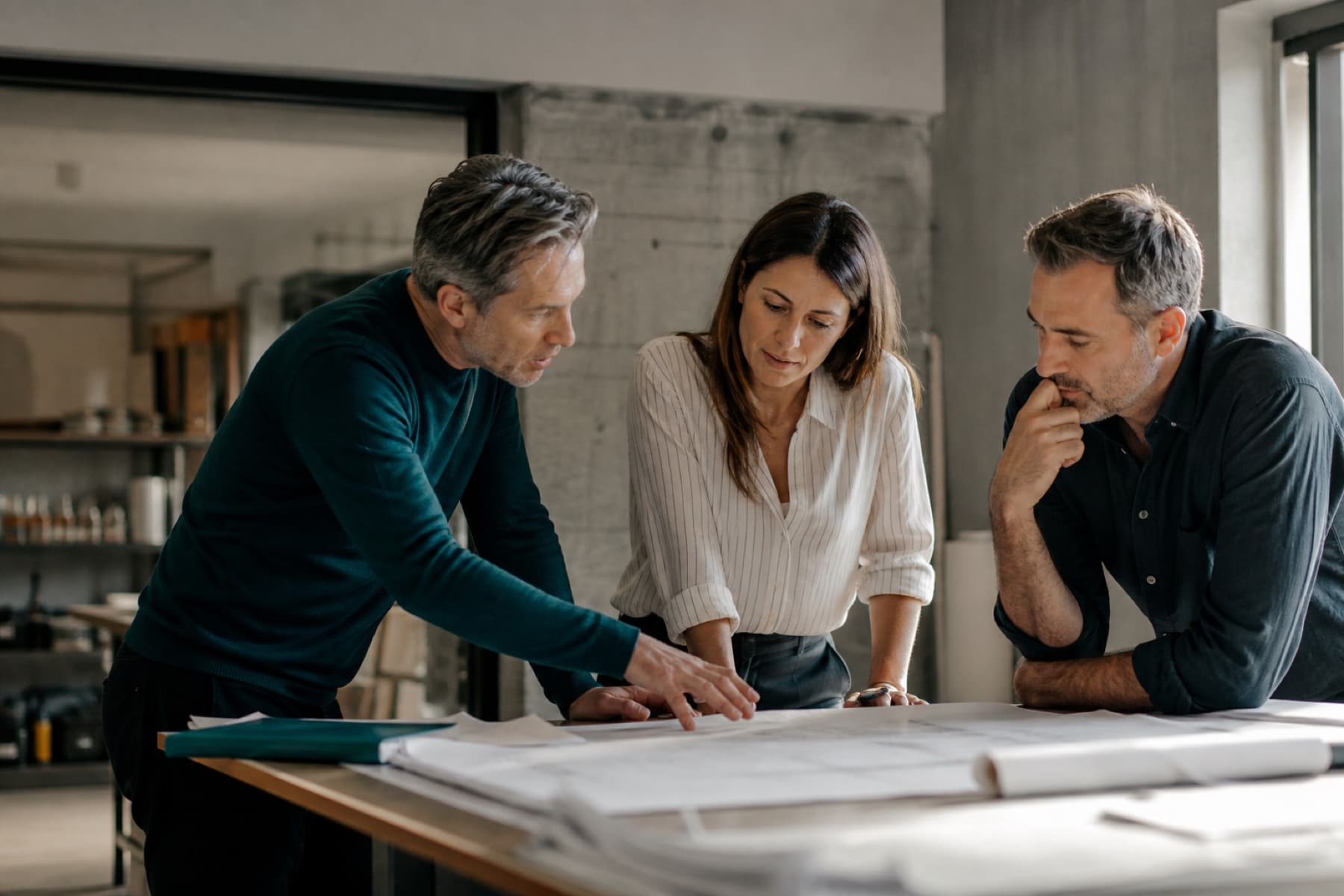 Three experienced colleagues applying human judgment to an important decision